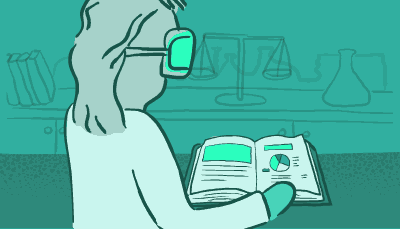 A scientist looks at an open book on a laboratory countertop